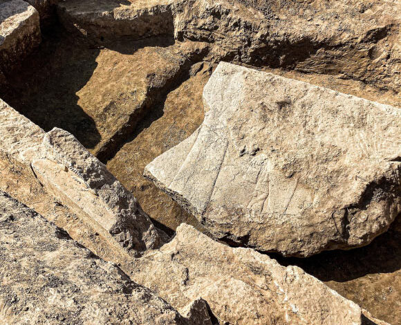 A fragment of the 2,600-year-old stone relief from the archaeological site of Nineveh. Image credit: Aaron Schmitt.
