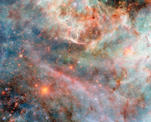This Hubble image shows a portion of a colorful nebula in the Large Magellanic Cloud, a dwarf galaxy located 160,000 light-years away from Earth in the constellations of Dorado and Mensa. Image credit: NASA / ESA / Hubble / C. Murray.