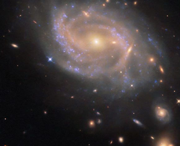 This Hubble image shows NGC 3285B, a barred spiral galaxy some 137 million light-years away in the constellation of Hydra. The color image was made from separate exposures taken in the ultraviolet and infrared regions of the spectrum with Hubble’s Wide Field Camera 3 (WFC3). It is based on data obtained through seven filters. Image credit: NASA / ESA / Hubble / R.J. Foley, UC Santa Cruz.