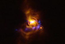 This image shows a possible substellar companion orbiting the young star V960 Mon. The candidate object was found with ESO’s Very Large Telescope (VLT), using its new Enhanced Resolution Imager and Spectrograph (ERIS). The new ERIS data are shown here in orange, overlaid on older images of the dusty disk as seen with the VLT’s SPHERE instrument (yellow) and ALMA (blue). Image credit: ESO / A. Dasgupta / ALMA / ESO / NAOJ / NRAO / Weber et al.